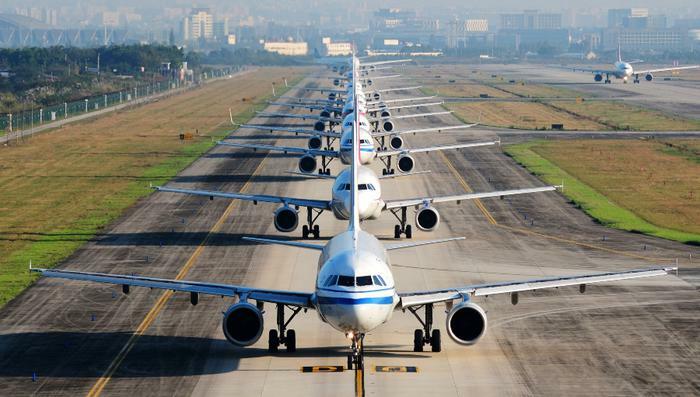 Airplanes in row on runway