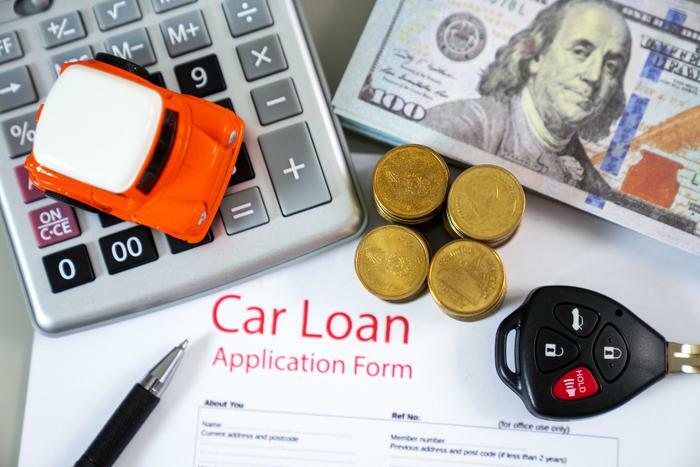 Car loan application with money and calculator