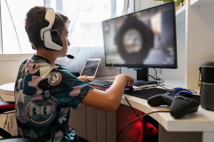 Child playing violent video game