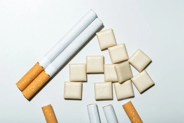 https://media.consumeraffairs.com/files/cache/news/Cigarettes_and_nicotine_gum_stephenallen75_Getty_Images_medium.webp