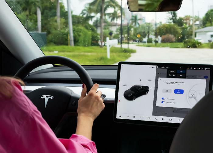 Consumer driving Tesla vehicle