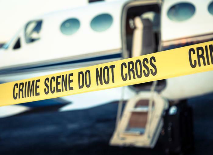 Crime scene tape around airplane
