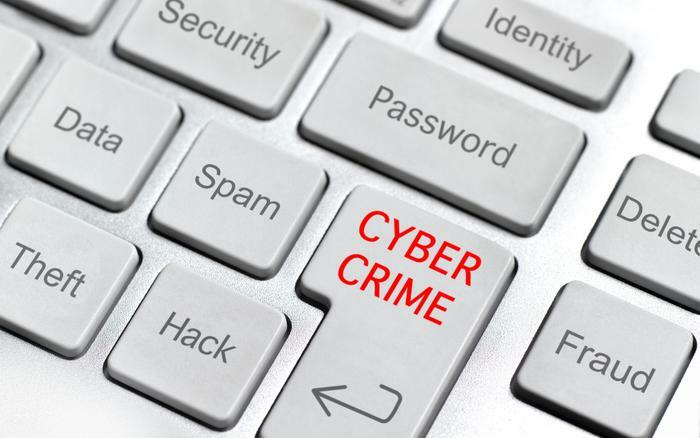 Cyber crime and scams concept on keyboard