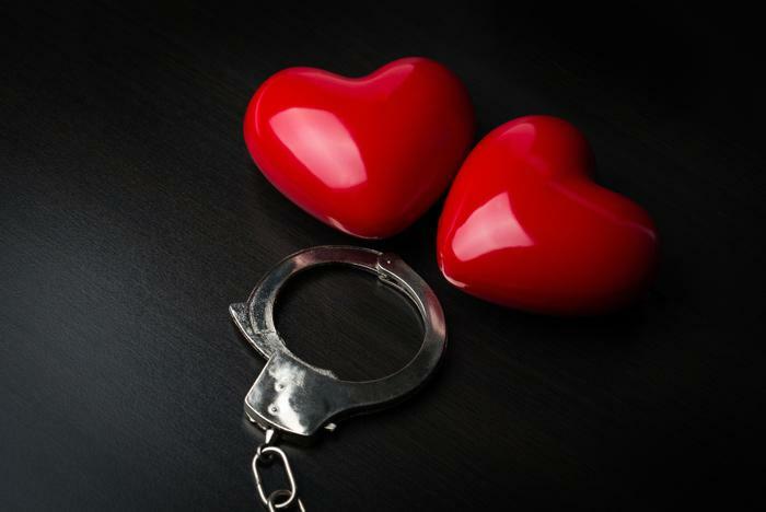 Handcuffs and hearts concept