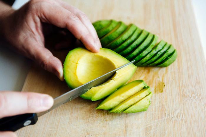 Man cutting avocado