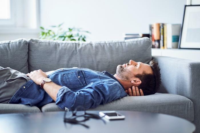 Man napping on couch