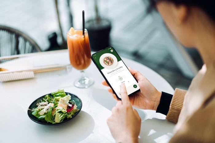 Person ordering healthy food on app