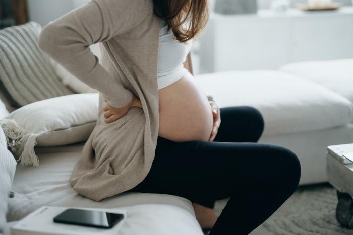 Pregnancy and back pain concept
