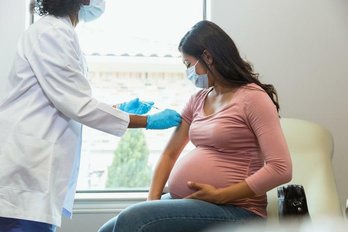 Pregnant woman receiving COVID-19 vaccine