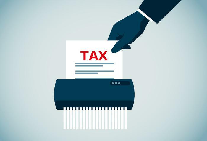 Shredding tax form document concept