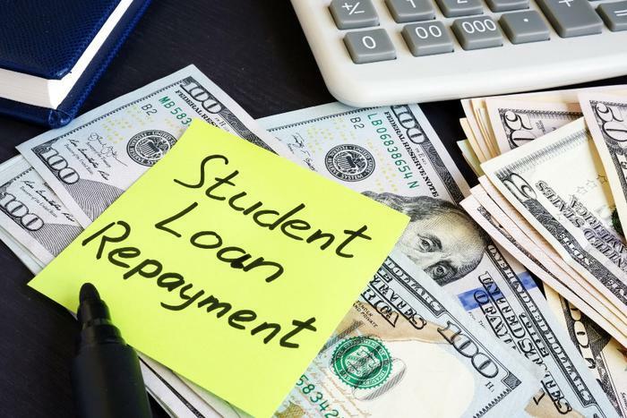 Student loan repayment concept with money