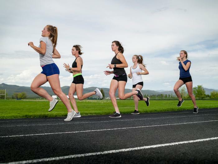 Teen girls running on track
