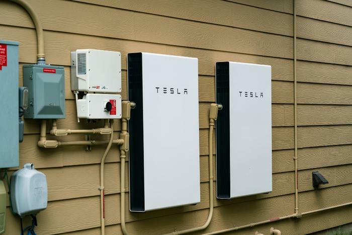Tesla solar powerwall on house