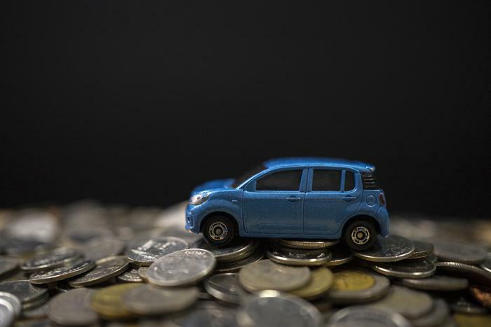 Toy car on coins