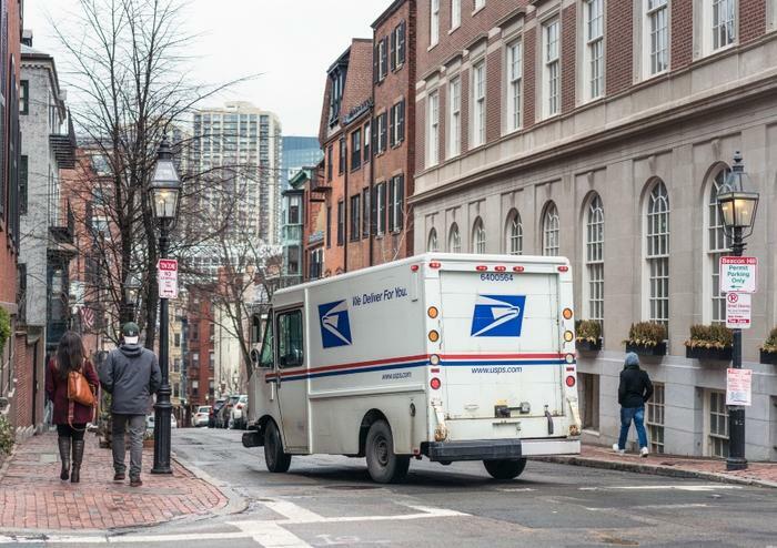 USPS truck in city