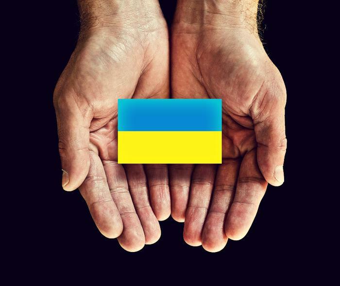 Ukraine flag in hands