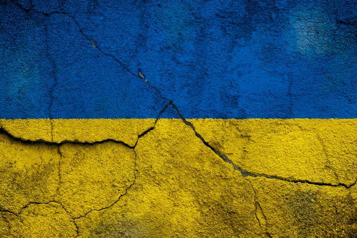 Ukraine flag on cracked wall