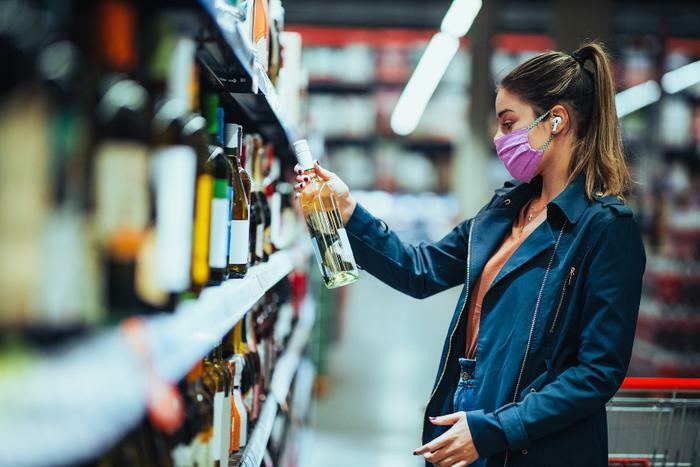 Woman buying alcohol during COVID-19 pandemic