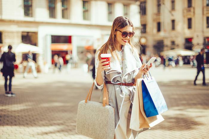 Woman drinking coffee and shopping