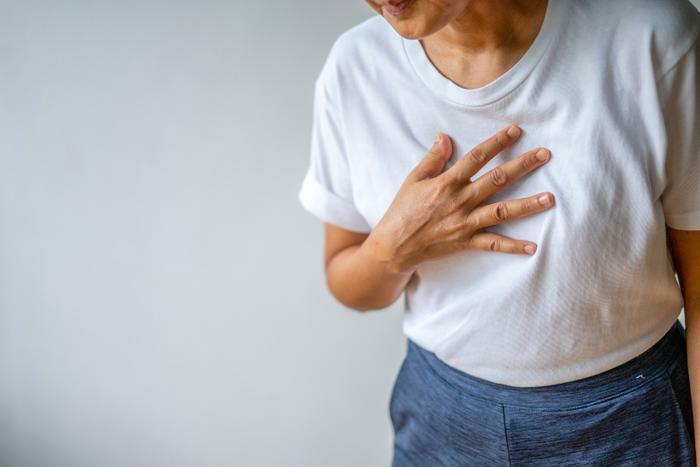 Woman suffering heart attack or stroke