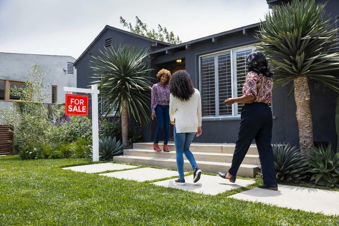 Women looking at home for sale