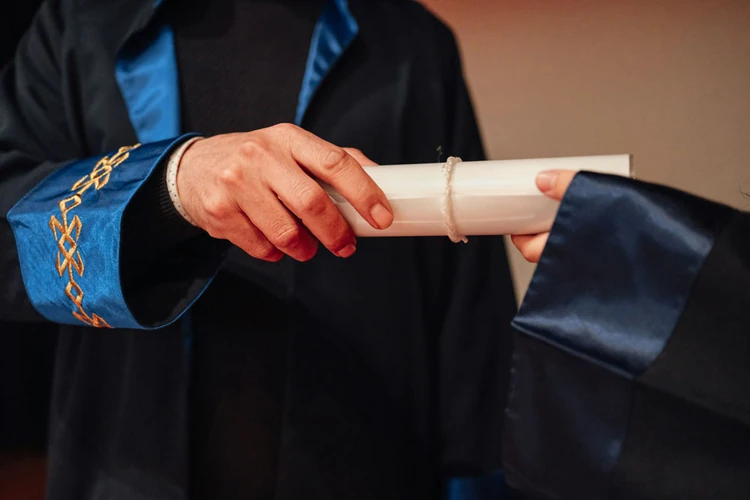 “a photo of someone getting their college diploma.