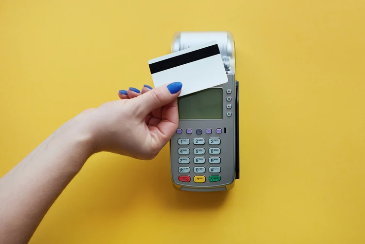 A credit card machine running a bill