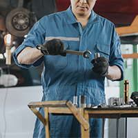 car technician holding tools