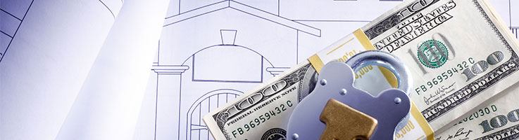 money and lock on top of sketch of a house