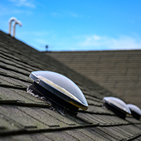 solar tube skylight on asphalt shingle roof