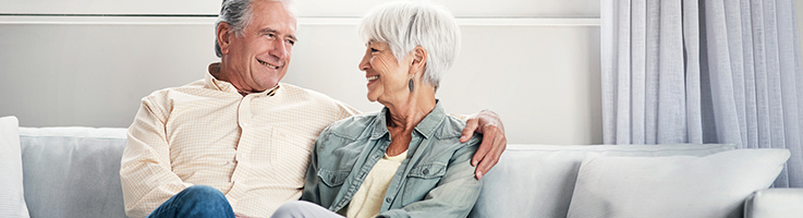 older couple sitting on couch