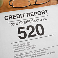 printed copy of a credit report with low score