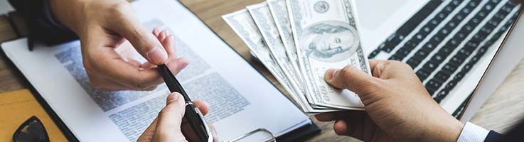 banker giving loan during contract signing