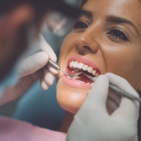 a woman having her teeth checked