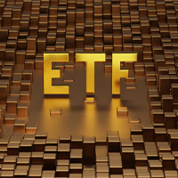 gold etf letters on top of metal bars