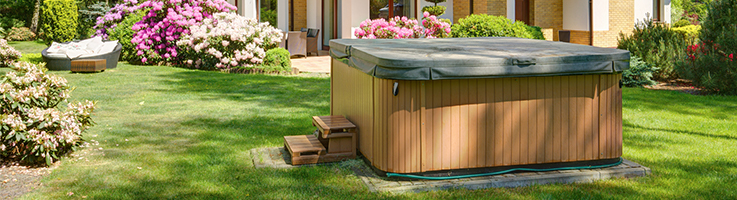 green hot tub cover in lawn