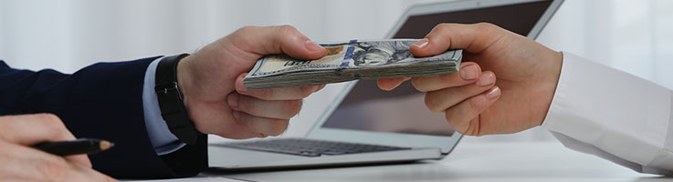 lender handing over money to borrower
