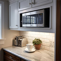 built-in microwave in wall cabinet above countertop