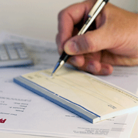 man writing a check