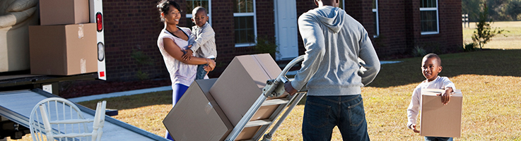 family loading a moving truck