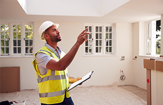 home inspector looking at house