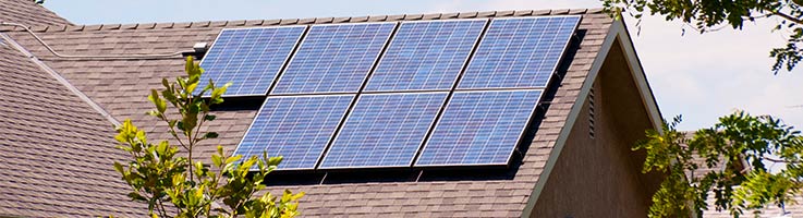 roof of suburban home with solar panels