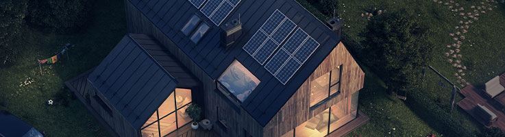 house with solar panels at night