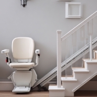 a stair lift parked at the bottom of a staircase