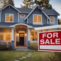 house with a for sale sign