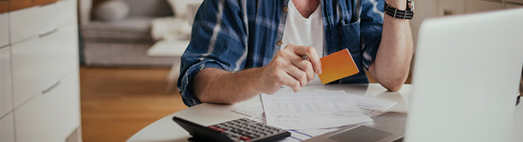 man working on finances