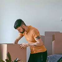 man packing in boxes