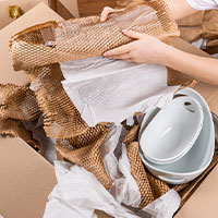 person packing fragile items
