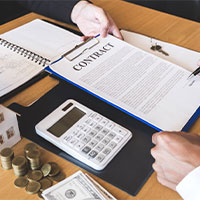 rep showing buyer paperwork for home buying