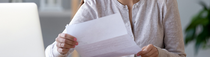 woman holding letter from irs